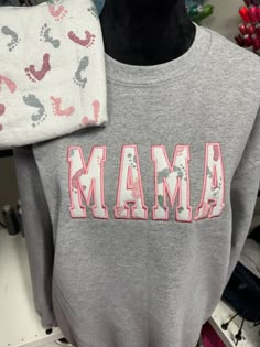 Mama Embroidered Baby Outfit Keepsake Applique Sweatshirt, Gift for Mom, Personalized Mama Shirt, Mama Keepsake Sweatshirt With Baby Clothes - Etsy Customizable Cotton Sweatshirt For Loungewear, Personalized Cotton Sweatshirt For Mother's Day, Customizable Family Matching Cotton Sweatshirt, Personalized Cotton Sweatshirt As A Gift, Personalized Cotton Sweatshirt As Gift, Cotton Sweatshirt With Letter Embroidery For Loungewear, Customizable Cute Cotton Sweatshirt, Sweatshirt Embroidery Ideas, Cricut Personalized Gifts