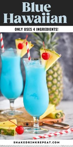 two blue hawaiian cocktails with pineapple on the side