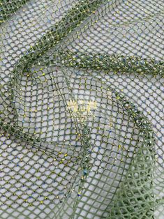 the net is covered with beads and thread