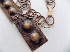 "I have owned this necklace since the 70's, and I am convinced it is a hand made artist studio piece. It reminds me of the late beatnik, early hippy art pieces I wore myself, over a black turtleneck, back in the day. The links are easy to bend by hand, if you want them to look all the same, but I like the mish mash look of this, and always got a lot of compliments when I wore it. Some call it Brutalist, and some say it is MCM. No signature or markings. Just a great statement piece! One of a kind Hippy Art, Modernist Art, Mish Mash, Modernist Jewelry, Copper Pendant, Black Turtleneck, Copper Necklace, Hammered Copper, Copper Pendants