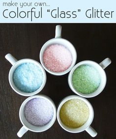 four small bowls filled with different colored glitter