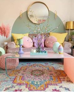 the living room is decorated in pastel colors and has an oval mirror on the wall