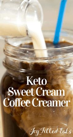 keto sweet cream coffee creamer in a jar with a blue straw sticking out of it