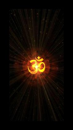 the om shan symbol on a black background with bright rays in the air and stars around it