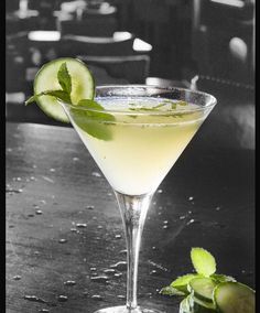 a limeade cocktail with a slice of lime on the rim