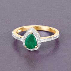 "14K Gold Emerald Ring, Genuine Zambian Emerald Pear and Diamond 14k Yellow Gold Ring, Halo Emerald Statement Ring, Emerald Engagement Ring Glam it up and shine like a star with this gorgeous bridge ring featuring a beautiful pear genuine zambian emerald gemstone. Get ready for the oohs and ahhs with 0.88 ct. t.w. in this gorgeous ring for women, crafted in fine finish 14k yellow gold. Emeralds are one of the most precious and sought-after gemstones in the world. They have a vibrant green color Yellow Gold Pear-shaped Ring With Halo Setting, Pear-shaped Yellow Gold Ring With Halo Setting, Pear-shaped Yellow Gold Emerald Ring For Anniversary, Pear Shaped Emerald Ring In Yellow Gold For Anniversary, Pear-shaped Emerald Ring In Yellow Gold For Anniversary, Pear Shaped Rings With Diamond Accents, Yellow Gold Pear-shaped Ring With Diamond Accents, Emerald Statement Ring, Emerald Ring Gold