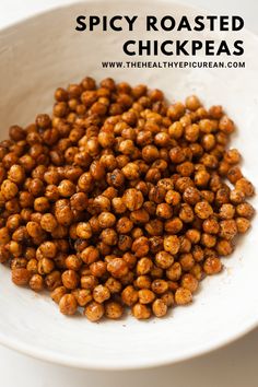 spicy roasted chickpeas in a white bowl with text overlay that reads spicy roasted chick peas