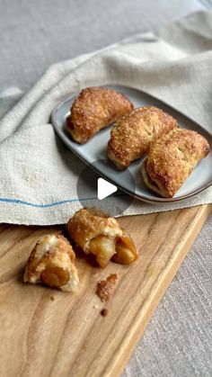 three pastries on a plate next to a napkin