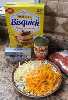 the ingredients to make pancakes are sitting on the kitchen counter next to it's package