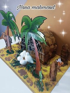 there is a cake with palm trees and animals on it