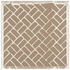 a brown and white tile pattern on a wall