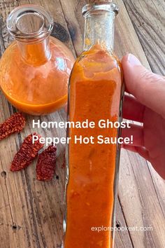 Glass bottles containing homemade ghost pepper hot sauce.  Someone is holding up one of the bottles and there are a few dried ghost peppers next to the bottles. Carolina Reaper Hot Sauce Recipe, Ghost Pepper Sauce, Ghost Pepper Hot Sauce, Fresh Tomato Recipes, Hot And Spicy