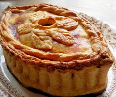 a pie sitting on top of a white plate