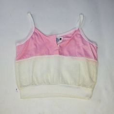 The left side does have some yellowing but this might come out after washing. I would also hang this to dry. USA MADE Brand new, originally deadstock Probably from the 70s 80s Fits best a xs or a small 70s Crop Top Vintage, 80s Crop Top Outfit, Retro Stretch Summer Tank Top, Retro Stretch Tank Top For Summer, 90s Style Camisole Tops For Summer, 90s Style Summer Camisole Tops, Retro White Crop Top For Summer, White Retro Crop Top For Summer, White Sleeveless Retro Crop Top