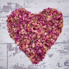 a heart shape made out of dried flowers