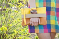 Bright yellow clutch bag "CarryMe". Made of soft vegan leather, fabric inside. Unique GoodMoodMoon model. Yellow shoulder strap comes with clutch so you can wear it like crossbody purse.Size: 9.5" х 6.5" (24 x 17 cm.) Shoulder strap length 46" (118 cm.) If you need another length just let us know :) Color: yellow + orange.Front handle color to choose: tan, yellow. Front  handle is easily changed on snaps - you can purchase additional handles of colors you like and change them according to your s Trendy Spring Crossbody Clutch, Trendy Crossbody Clutch For Spring, Spring Crossbody Clutch With Adjustable Strap, Trendy Handheld Clutch For Spring, Chic Yellow Clutch For Everyday Use, Trendy Clutch With Wrist Strap, Casual Spring Clutch For Everyday Use, Casual Clutch For Everyday Use In Spring, Chic Yellow Clutch For Daily Use