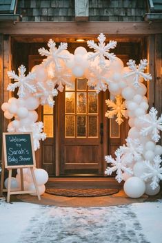 an entrance decorated with balloons and snowflakes