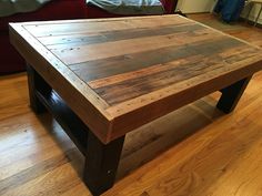 a wooden table sitting on top of a hard wood floor