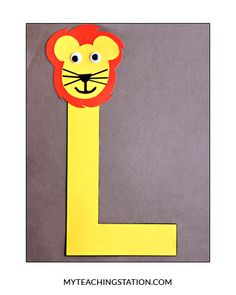 the letter l is made up of paper and has a lion face on it's head