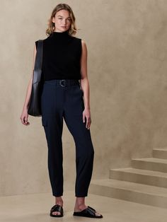 Utility with a twist, this cargo pant is crafted using a luxurious and softly structured fabric, enhanced with advanced stretch for a refined look and feel.  SLIM FIT: High waisted, slim through hip and thigh, tapered leg.  Ankle length.  Zip fly with hook and bar closure.  Removable belt.  Front, back and side cargo pockets.  Pleated detail at the cuff.  Unlined.  SLIM FIT: High waisted, slim through hip and thigh, tapered leg.  Ankle length.  Ankle length.  Inseams: Petite/Short 24", Regular 2 Ankle Pants Outfit, Barista Outfits, Business Casual Womens Fashion, Tapered Pant, Structured Fabric, Teaching Outfits, Fantasy Wardrobe, Cargo Pants Outfit, Professional Outfits Women