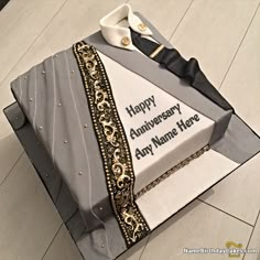 a birthday cake that is shaped like an envelope with the words happy anniversary to any name here