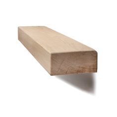 a piece of wood sitting on top of a white wall