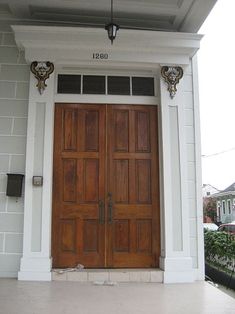 an image of a wooden door on the side of a house with text overlaying it