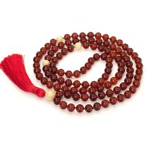 Buddhist meditation rosary made of Baltic Amber on a red sord. Mala is handmade in our workshop in Wroclaw Poland with attention to every detail. This is a Mala 108 the highest quality.  ♻️🎁Each of our products is gift-wrapped free. For the convenience of storing the Mala, we give an Eco Bag with our logo Mariiel. About the product: Material: Baltic Amber The circumference is about 85 cm Bead size: 8 mm Weight: 35 gr. This inspiring Buddhist Mala Rosary is very important tool when reciting mantras, meditation or yoga. Mala 108 ✅ helps to concentrate our thoughts on meditation exercises, ✅ helps to calm our thoughts during meditation. ⚡️ If the energy during meditation is low, you can then fall asleep. If the energy is too high, fantasy and distraction are barriers. At such times, Mala pro Red Handmade Mala For Healing, Red Hand-strung Spiritual Mala, Red Hand-strung Mala For Healing, Handmade Red Mala For Healing, Red Gemstone Beads Mala As Gift, Red Mala With Gemstone Beads As Gift, Hand-strung Red Mala As A Gift, Red Hand-strung Mala As Gift, Red Beaded Rosary For Spiritual Use