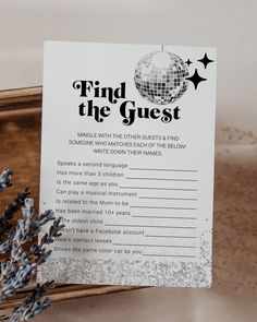 a sign that says find the guest on it next to some lavenders and a mirror