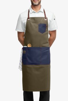 a man is wearing an apron and has his hands on his hips while standing in front of the camera