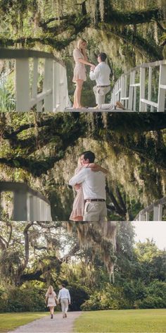 a man and woman standing under a large tree in front of a white house with moss hanging from it's branches