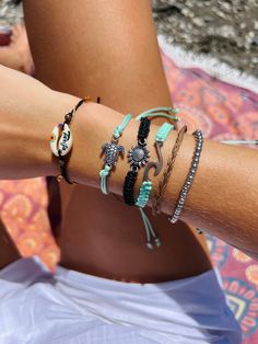 This cute beach bracelet is a delightful accessory that encapsulates the carefree spirit of summer. Featuring an array of small, colorful beads interspersed with charming seashells and ocean-themed charms, this bracelet adds a playful touch to any outfit.  These adjustable design bracelets ensures a comfortable and secure fit for all wrist sizes, making it a versatile accessory for any occasion.  Perfect for adding a coastal flair to your everyday look, these bracelets is a must-have for beach l Adjustable Beaded Bracelets For Beach Season, Adjustable Beachy Friendship Bracelets, Turquoise Bohemian Strand Friendship Bracelets, Adjustable Braided Bracelets For Beach Vacation, Adjustable Coastal Beaded Bracelets For Summer, Handmade Adjustable Coastal Beaded Bracelets, Beach Friendship Bracelets With Sliding Knot, Summer Bracelets For Beach Vacation, Adjustable Friendship Bracelets For Beach Vacation