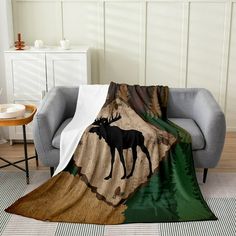 a moose is standing in the woods on a blanket