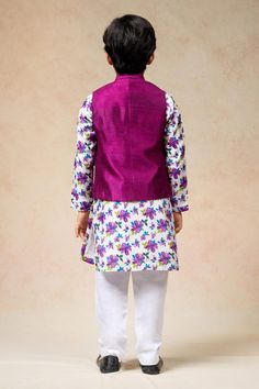 Purple sleeveless solid bundi with mandarin collar neckline. Paired with full sleeves peony bloom kurta and a pyjama. - Aza Fashions Fitted Festive Vest For Spring, Fitted Sleeveless Kurta For Spring, Spring Fitted Sleeveless Kurta, Sleeveless Nehru Jacket For Diwali, Fitted Sleeveless Nehru Jacket For Festivals, Fitted Sleeveless Nehru Jacket For Festive Occasions, Festive Fitted Sleeveless Nehru Jacket, Pajama Pattern, Boys Kurta