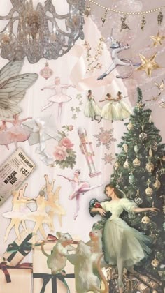 a christmas tree surrounded by tinkerbells and fairy figurines