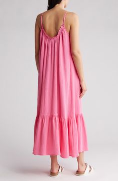 Breeze through sunny days in this breathable cotton gauze maxi dress featuring slender adjustable straps and a flowy flounced hem. 51" length (size Small) Slips on over head Scoop neck Adjustable straps 100% cotton Hand wash, dry flat Imported Pink Maxi Dress With Ruffle Hem For Vacation, Pink Maxi Dress With Ruffled Straps For Vacation, Pink Summer Maxi Dress With Ruffled Straps, Breezy Cotton Gauze Vacation Dresses, Breezy Cotton Gauze Dresses For Vacation, Breezy Ruffled Maxi Dress For Vacation, Flowy Breezy Sundress With Ruffles, Beach Maxi Dress With Ruffle Hem, Spring Beachwear Maxi Dress With Adjustable Straps