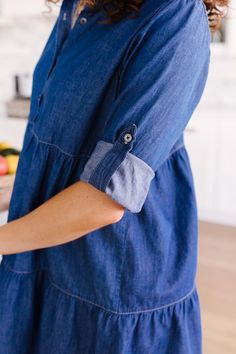 This 3 tiered denim dress is so versatile you will find yourself reaching for it to add a touch of trendy styling to any outfit. Wear as a dress or effortlessly open over your favorite tank and shorts. It features a babydoll bodice that creates a gorgeous shape, functional buttons, and a roll-tab sleeve for functionality throughout the months.Lightweight + Roll-Tab SleevesFunctional Front Close Buttons + Tiered Skirt100% CottonWash Cold, Hang Dry Fits True To Size *Measurements listed below are Plaid Headband, Blue Jean Dress, Buttery Soft Leggings, Hand Bracelet, Darling Dress, Jeans Button, Denim Button Down, Button Down Dress, Find Yourself