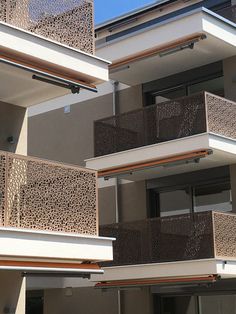 an apartment building with balconies and windows