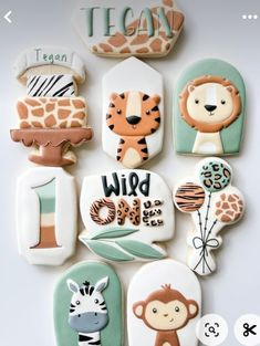 some cookies are decorated with animals and letters