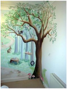 a child's room with a tree painted on the wall and radiator