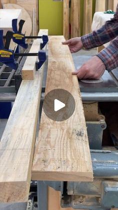 a man is working on some wood