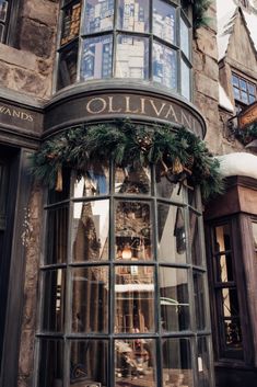 a store front with christmas decorations on the windows