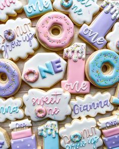 decorated cookies that say one sweet one and the number one are for children's first birthdays