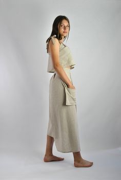 "This is our no. 15 of Conscious Clothing Concept. It is very modern and geometric. It is a belted wrap around skirt of different legths with a separate top adjusted with ties. This set is made of high quality pure linen in natural colour. It is the ultimate fabric for hot weather as it breathes and absorbs moisture better that any fabric on earth. Size M but as it is loose fitting there is room to for a bit smaller and bigger person. Please write if you need different size and we will make it f Beige Linen Dress With Tie Waist, Conscious Clothing, Beach Kaftan, Bigger Person, Linen Lights, Dress Modern, Geometric Dress, Beige Colour, Office Dress