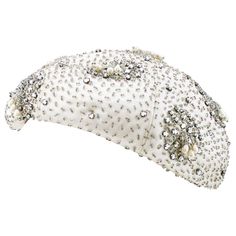 Fabulous 1950s silver beret. Embellished off-white satin fabric with small clear beads and silver rhinestones. Small beaded tassels with teardrop shaped pearls. Contrasting interior magenta grosgrain ribbon. 22.5" perimeter. Glitzy and fun. Excellent vintage condition. Beret Embellishment, Leaf Hat, 1950 Style, White Satin Fabric, Large Brim Hat, 1950 Fashion, Clear Beads, Cocktail Hat, Designer Hats