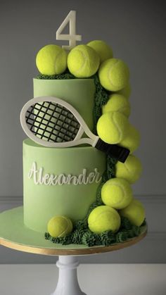 a cake with tennis balls and a racket on top