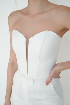 Elevate your wedding attire with our exquisite satin corset. Designed with cups and bones, it flawlessly sculpts your figure, while the back laces ensure a perfect fit. Pair it seamlessly with our matching skirt Cecil for a stunning ensemble on your special day. Wedding Separates Two Pieces, Elegant Formal Corset With Sheer Bodice, Formal Corset With Sheer Bodice And Sweetheart Neckline, Formal White Corset Dress With Sweetheart Neckline, Elegant Corset With Lace Bodice, Elegant Wedding Corset With Sheer Bodice, Wedding Corset Dress With Lace Bodice, White Overbust Wedding Dress, Elegant Corset With Heart-shaped Neckline