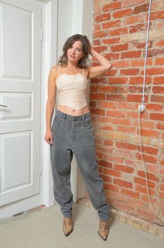 Embrace the iconic style of the 80s with these vintage Angels high-waisted wide-leg baggy jeans, made in Italy. Featuring a flattering high waist and a relaxed, wide-leg fit, these jeans capture the bold, carefree fashion of the era. The baggy silhouette offers comfort without compromising on style, making them perfect for a casual, yet statement-making look. In size small, these jeans are in excellent vintage condition and are a must-have for any denim lover or vintage fashion enthusiast. - Lab Wide Leg Baggy Jeans, Carefree Fashion, Vintage Angels, Fashion Enthusiast, Iconic Style, Womens Jeans, Mode Vintage, Baggy Jeans, Black Fabric