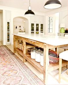 a large kitchen island with baskets on it