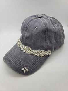 This is a new product from Handmade MKE! This is a distressed gray one size fits all baseball cap with a hole for your ponytail in the back, it is also adjustable. On the front of the hat is band of clear rhinestones, marquise opal stones, sequins and beads. On the brim of the hat are three more opals and a single circular rhinestone. This is very comfortable, and great to throw on with a plain white T-shirt! Like our Facebook Page and get 10% off when you message me before checkout! Everything Hat Embellishments, Custom Baseball Hats, Hat Ponytail, Baseball Mom Gifts, Custom Embroidered Hats, Girl Baseball Cap, Ponytail Baseball Cap, High Pony, Plain White T Shirt